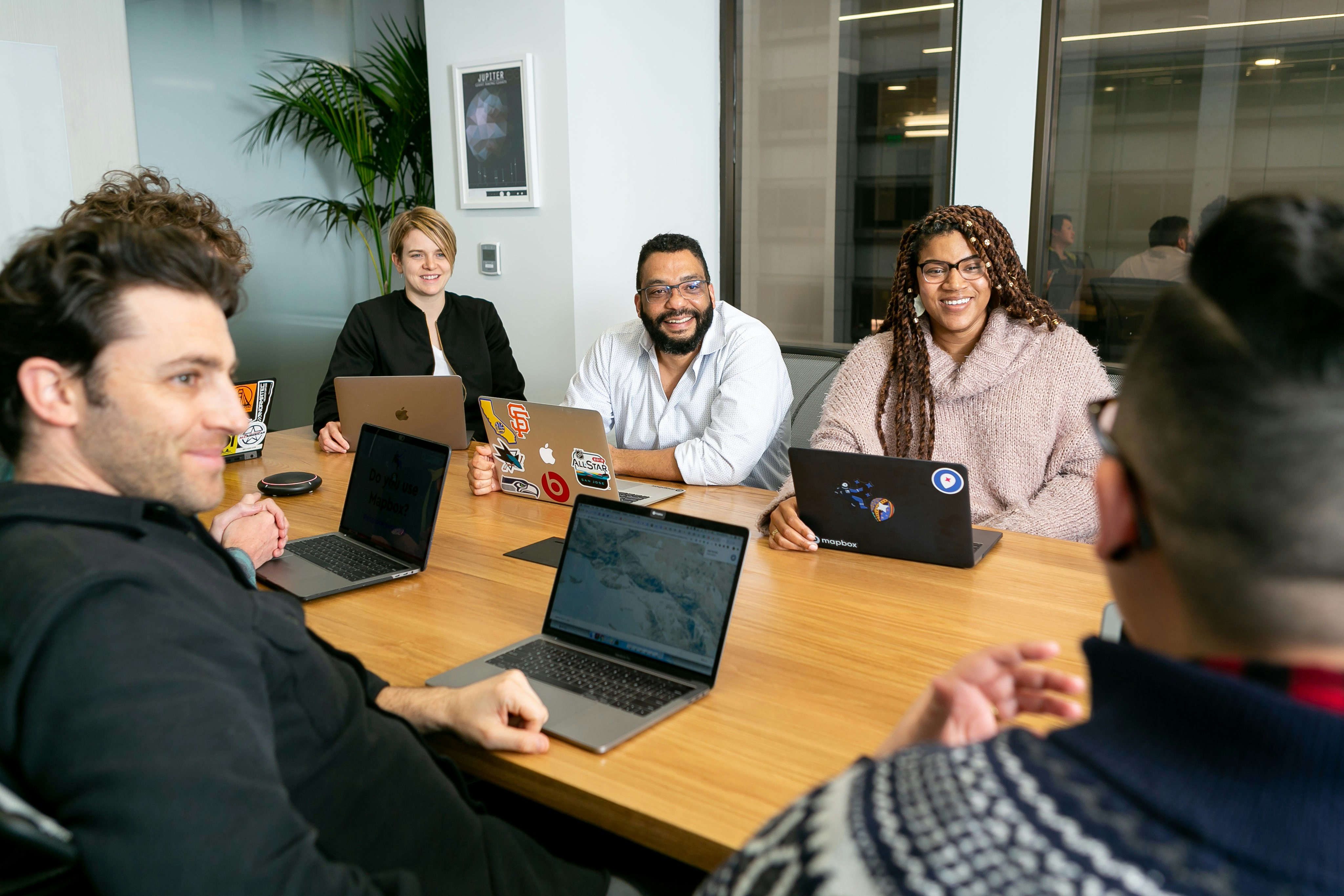 people sitting at a desk having a meeting